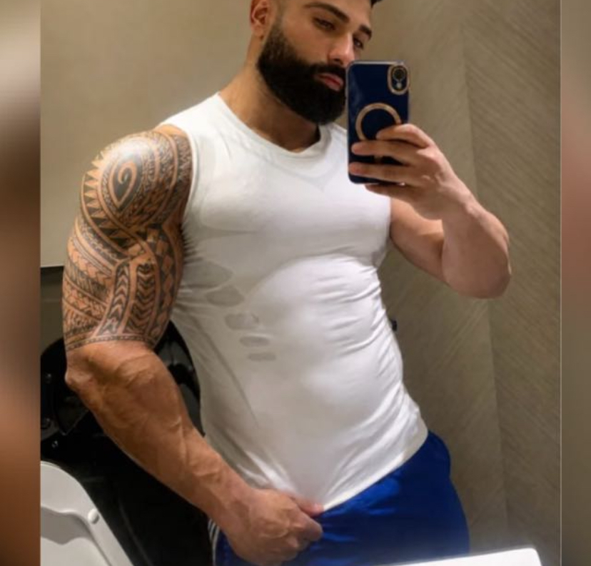 GURU training progress in a white sleeveless top